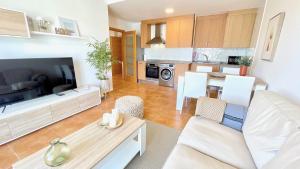 a living room with a large flat screen tv at The Cliffs - Guiana Mar in O Vicedo
