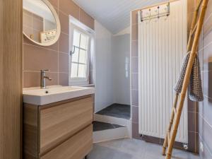 a bathroom with a sink and a mirror at Maison de charme avec jardin près de Nantes, 4 chambres, wifi, équipements bébé et babyfoot - FR-1-306-1272 in Le Bignon +14 photos