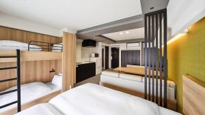 a bunk bed room with two bunk beds at MIMARU KYOTO STATION in Kyoto