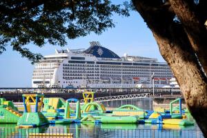 a cruise ship with a bunch of inflatable water slides at Oceania at Darwin Waterfront in Darwin