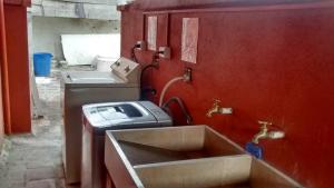 a bathroom with a sink and a toaster at usoinmobiliario in Medellín +48 photos