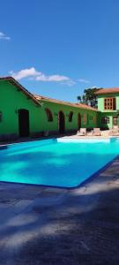 Swimmingpoolen hos eller tæt på Antonietta Hospedagem e Eventos - Conforto em pleno mar de morros de Cunha