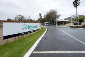 a sign on the side of a road at Tasman Holiday Parks - Albany in Albany