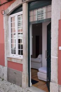 an open door of a building with a window at Cool Tailor Made 2 Bedroom Apartment in Lisbon