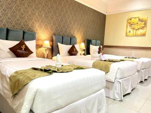 Postel nebo postele na pokoji v ubytování Amarelo Hotel Solo