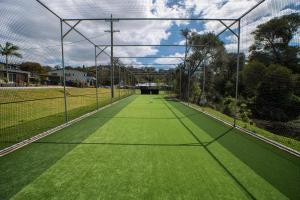 a tennis court with a net on top of it at Tasman Holiday Parks - Merimbula in Merimbula