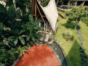 an overhead view of a house with a garden at Cacao House 4bds Eco Bamboo House, pool, near Green School Bali in Bringkit