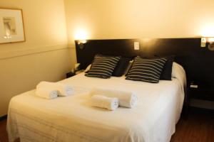 Cama ou camas em um quarto em Abril Hotel Boutique