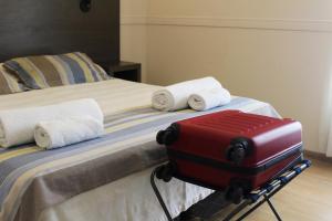 Cama ou camas em um quarto em Abril Hotel Boutique