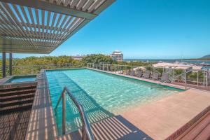a swimming pool on top of a building at 315 Harbour With Ocean Views in Cairns