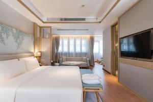 TV a/nebo společenská místnost v ubytování Atour S Hotel SHanghai Baoshan Gucun Park