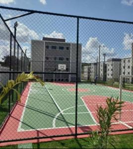 a tennis court with a net on a court at Studio Garden 03 in Caruaru +43 photos