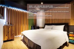 a poster of a bedroom with a large bed at Calligraphy Greenway Hotel in Taichung