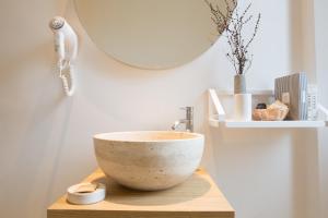 a bathroom with a bowl sink and a mirror at B&B Santa Maria del Fiore in Florence