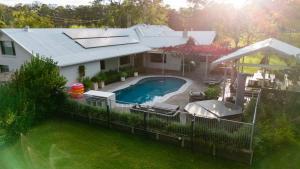 an aerial view of a house with a swimming pool at Whitevale Luxury Estate in Lovedale
