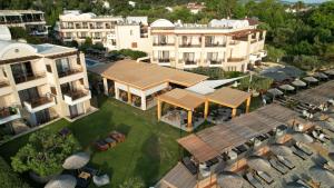 an aerial view of a building with a resort at Olympion Sunset Halkidiki in Fourka