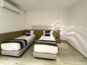 Cama ou camas em um quarto em Hotel Catedral Plaza