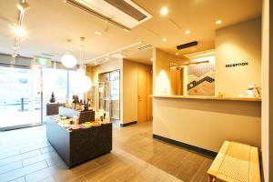 a store lobby with a hair salon with a counter at Rakuten STAY Kyoto Station in Kyoto