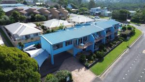 an aerial view of a house with a blue roof at BlueWater Apartments in Merimbula
