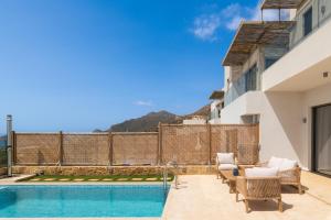 a villa with a swimming pool with a view at Diamond Star Hotel in Falasarna