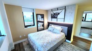 a bedroom with a bed with a picture of a deer on the wall at City Views Penthouse NYC in 5min in Hoboken