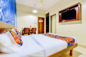 Postel nebo postele na pokoji v ubytování FabHotel Ashirwad - Nr Mall De Goa, Porvorim