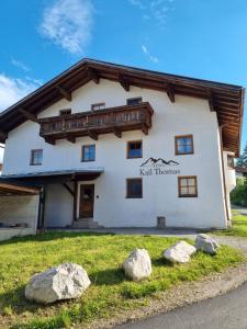 a building with rocks in front of it at Ferienwohnungen Kail Thomas in Obsteig