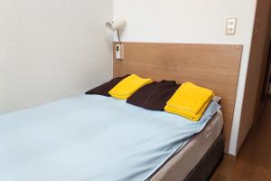 Ένα ή περισσότερα κρεβάτια σε δωμάτιο στο Hotel Frontier