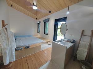 Ένα ή περισσότερα κρεβάτια σε δωμάτιο στο Starstay Wuling Mountain B&B
