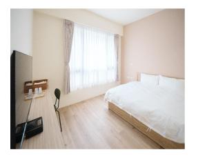 Postel nebo postele na pokoji v ubytování Mi Lu Inn + 7 fotografií