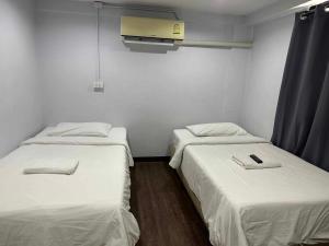 Ein Bett oder Betten in einem Zimmer der Unterkunft X GO INN Chiang Mai University - CMU โกอินน์ มหาวิทยาลัยเชียงใหม่