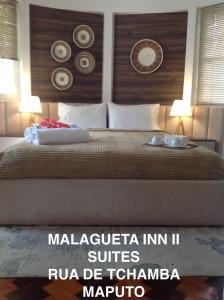 Ένα ή περισσότερα κρεβάτια σε δωμάτιο στο Guesthouse MALAGUETA INN II