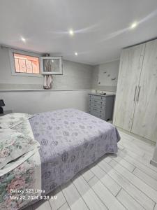 a bedroom with a bed and a dresser at HOME SWEET HOME in Chios +6 photos