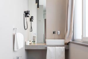a bathroom with a sink and a mirror at Milestone in Quartu SantʼElena