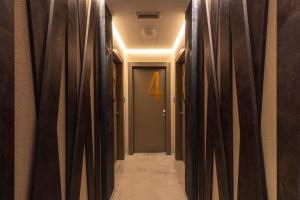 a hallway with a number four through the curtains at Milestone in Quartu SantʼElena