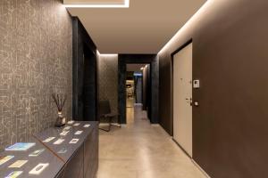 a hallway with a long line of hallways at Milestone in Quartu SantʼElena