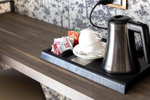 a tea kettle is sitting on a table at Milestone in Quartu SantʼElena