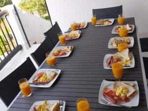a group of plates of food on a table at DZUVHA BOUTIQUE VILLA in Hartbeespoort