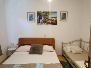 Postel nebo postele na pokoji v ubytování Apartmani Tereza