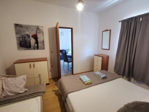 Postel nebo postele na pokoji v ubytování Apartmani Tereza