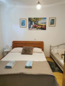 Postel nebo postele na pokoji v ubytování Apartmani Tereza