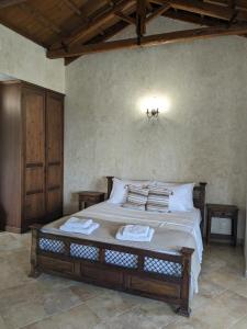 Ένα ή περισσότερα κρεβάτια σε δωμάτιο στο Meltemi Apartments