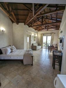 Ένα ή περισσότερα κρεβάτια σε δωμάτιο στο Meltemi Apartments