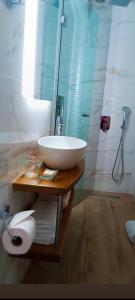 a bathroom with a white sink and a shower at Villa Nila in Ierissos