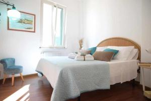 En eller flere senge i et værelse på La terrazza sul Borgo