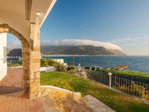 a view of the ocean from a house at Sunny Cove Manor in Fish hoek