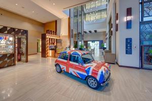 a small car parked in the middle of a mall at Metropolitan Hotel Dubai in Dubai