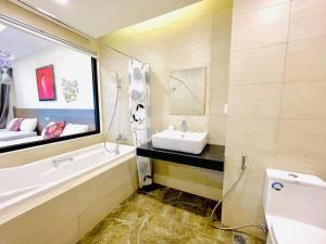 Katil atau katil-katil dalam bilik di FLC Sea Tower Quy Nhơn - Căn Hộ Du Lịch Chuẩn 5 Sao - View Biển có Hồ Bơi
