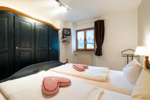 Postel nebo postele na pokoji v ubytování Haus Sonnenwinkel - SommerBergBahn unlimited kostenlos