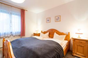 Postel nebo postele na pokoji v ubytování Haus Sonnenwinkel - SommerBergBahn unlimited kostenlos